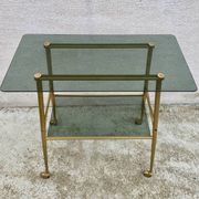 Vintage 1970s glass and gold rolling console table.