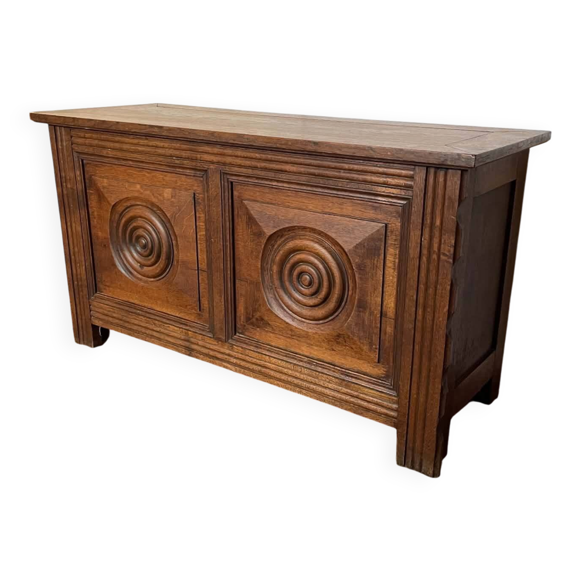 Small antique oak chest with carved panels.
