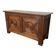 Small antique oak chest with carved panels.