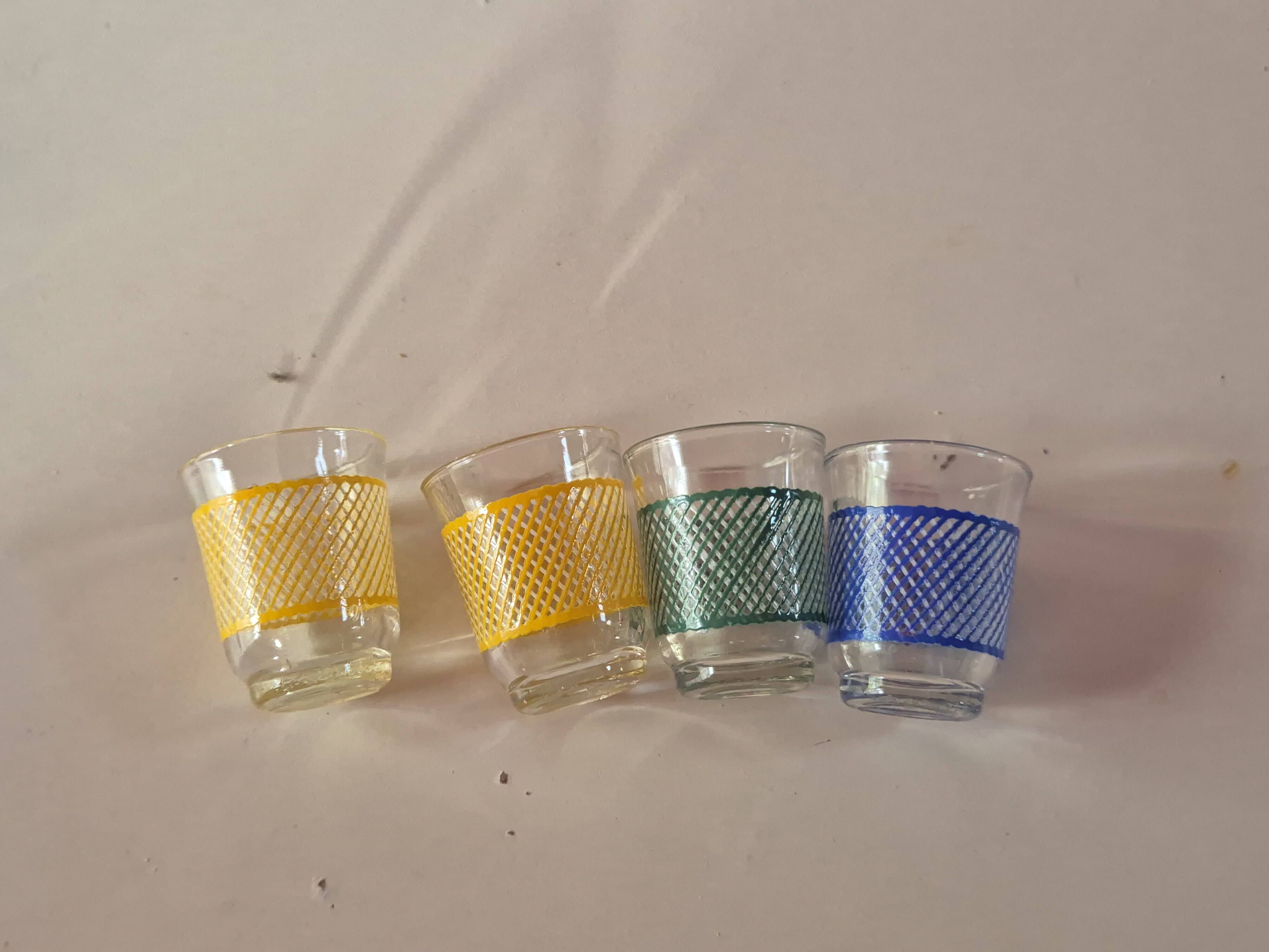 set of 4 vintage liqueur glasses in yellow, green, and blue