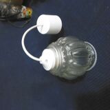 Pressed glass globe suspension