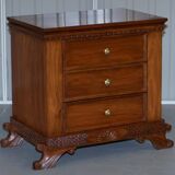 Set of hardwood dressers with finely carved bases.