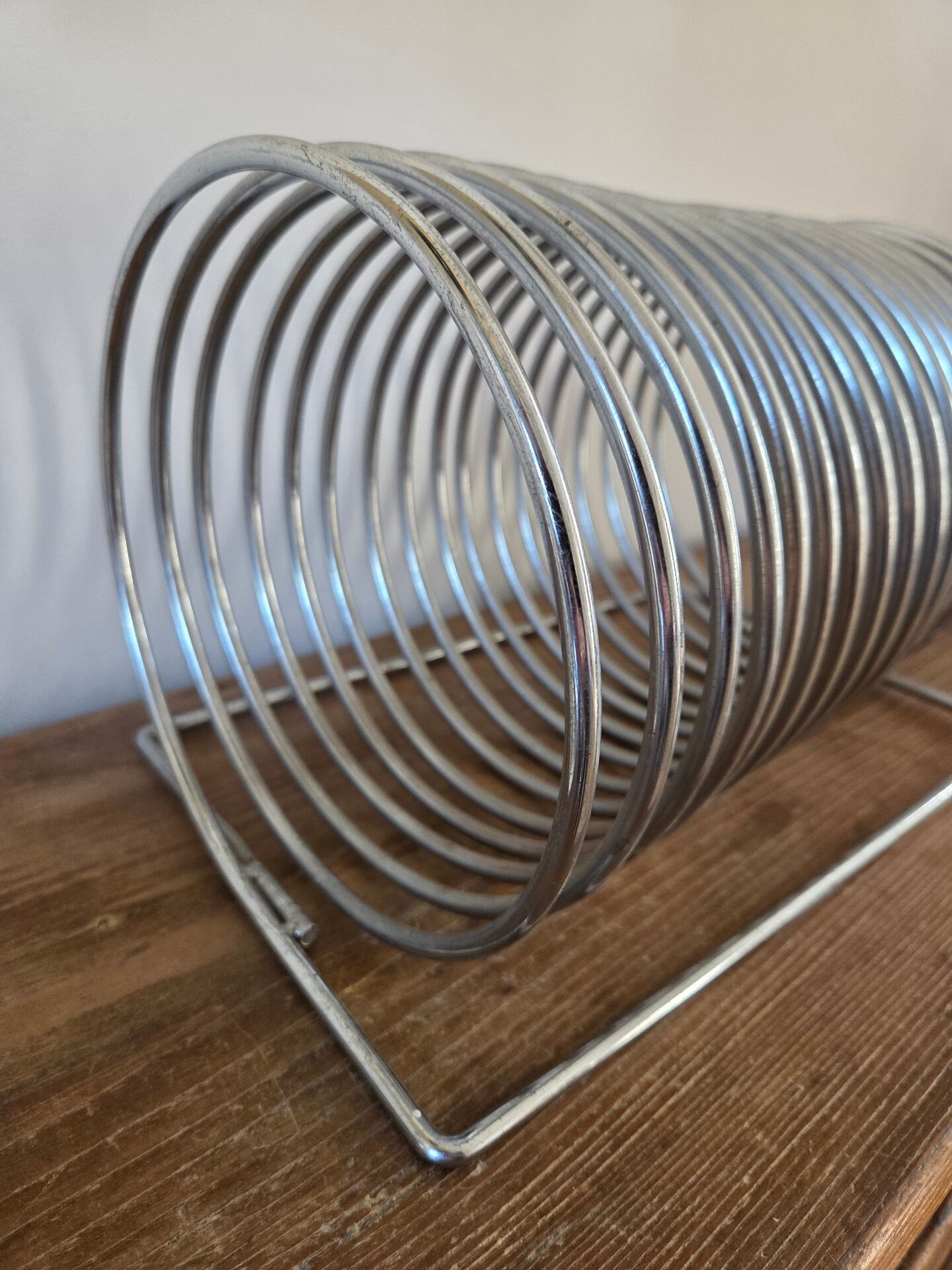 Chrome spring magazine rack, 1970