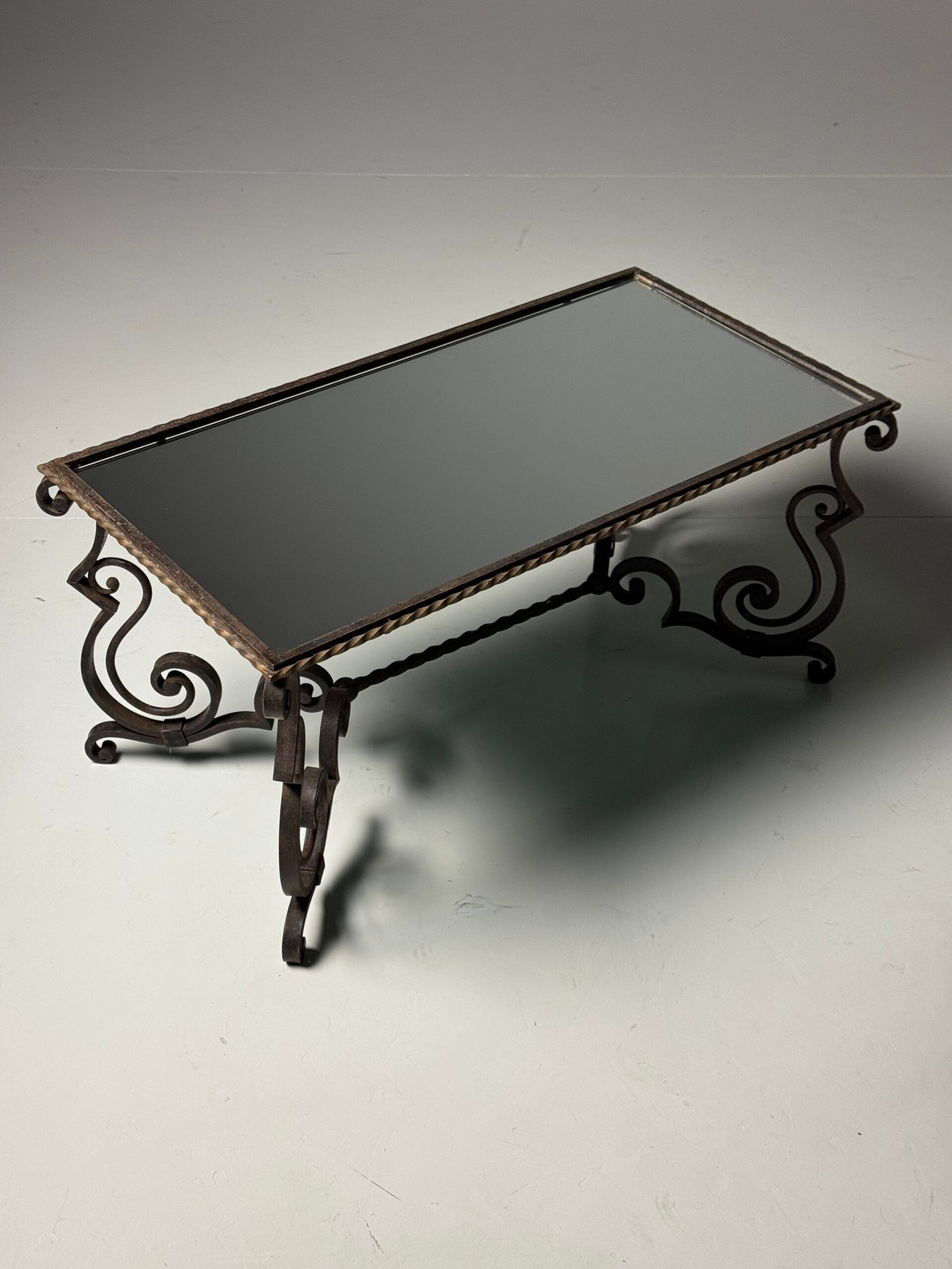 Wrought iron coffee table with mirror glass