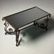 Wrought iron coffee table with mirror glass