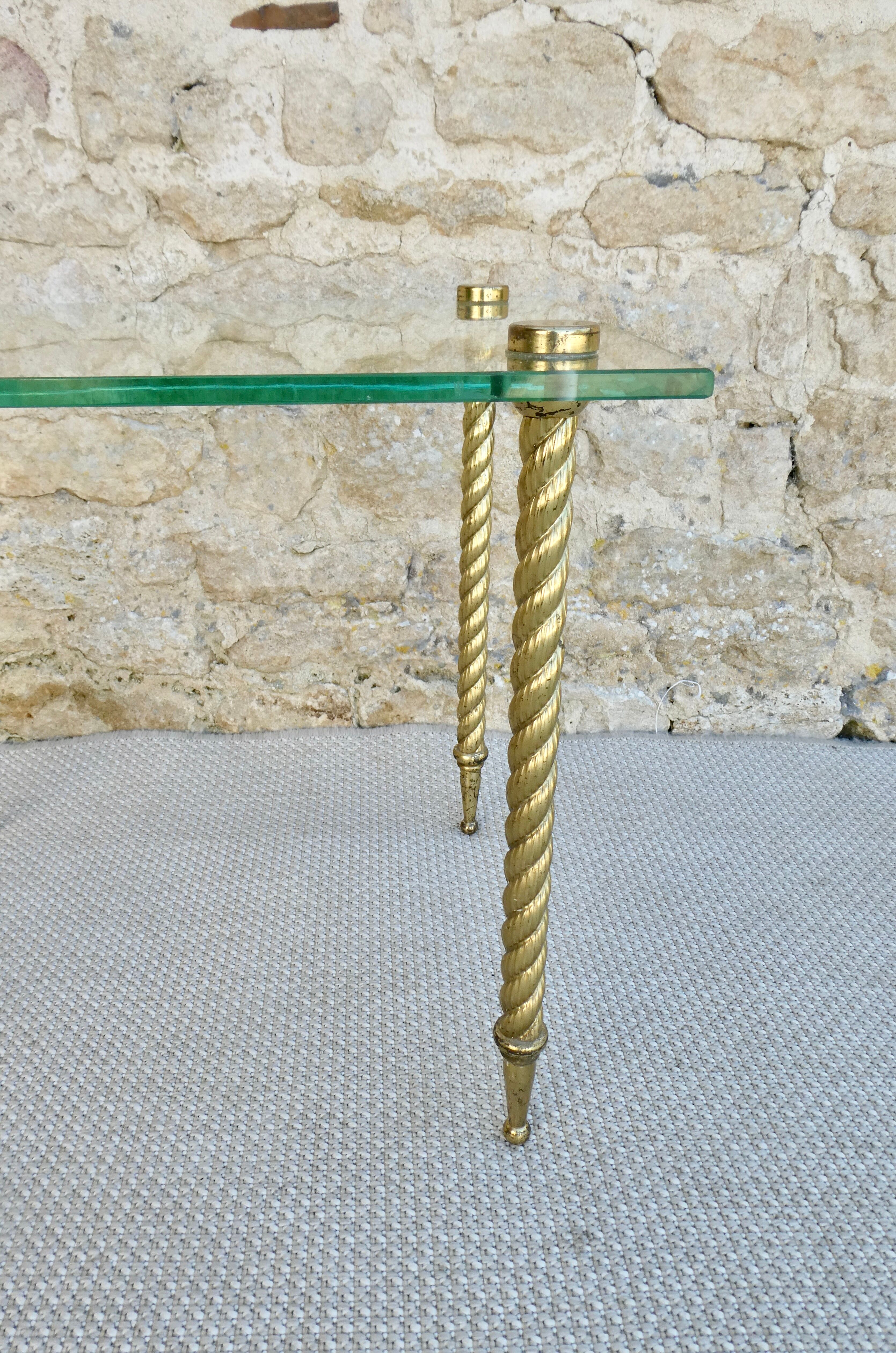 End of sofa, glass and twisted legs in gilded metal