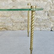 End of sofa, glass and twisted legs in gilded metal
