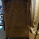 comfortable colonial-style armchair in rattan and mahogany