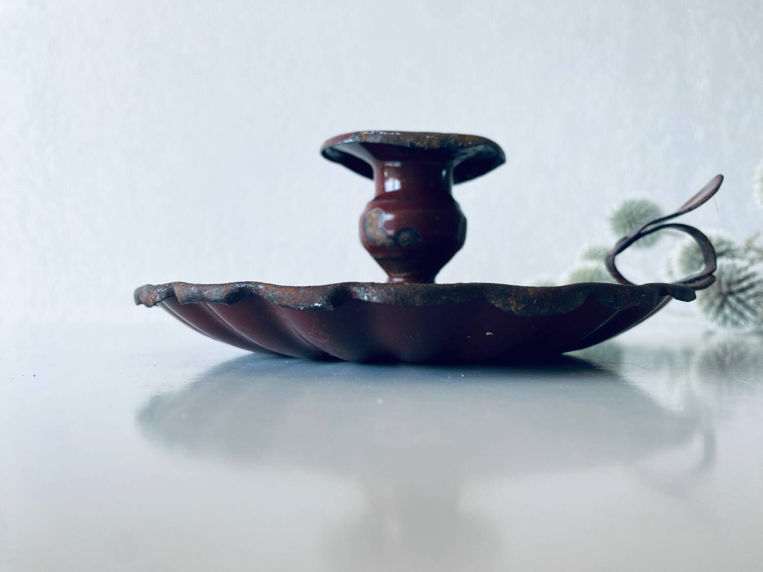 Antique enamelled candle holder