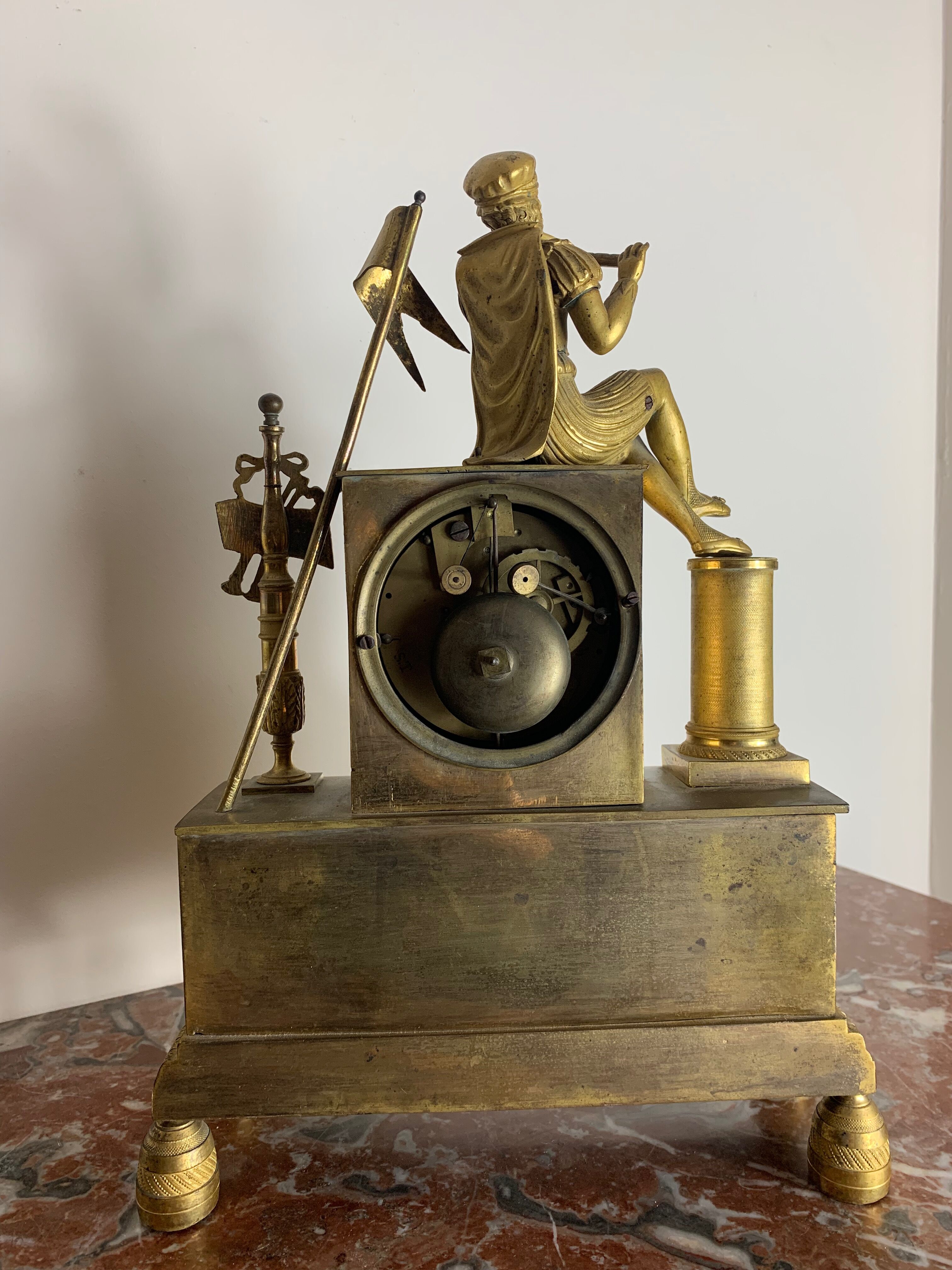 Period clock restoration in gilded bronze