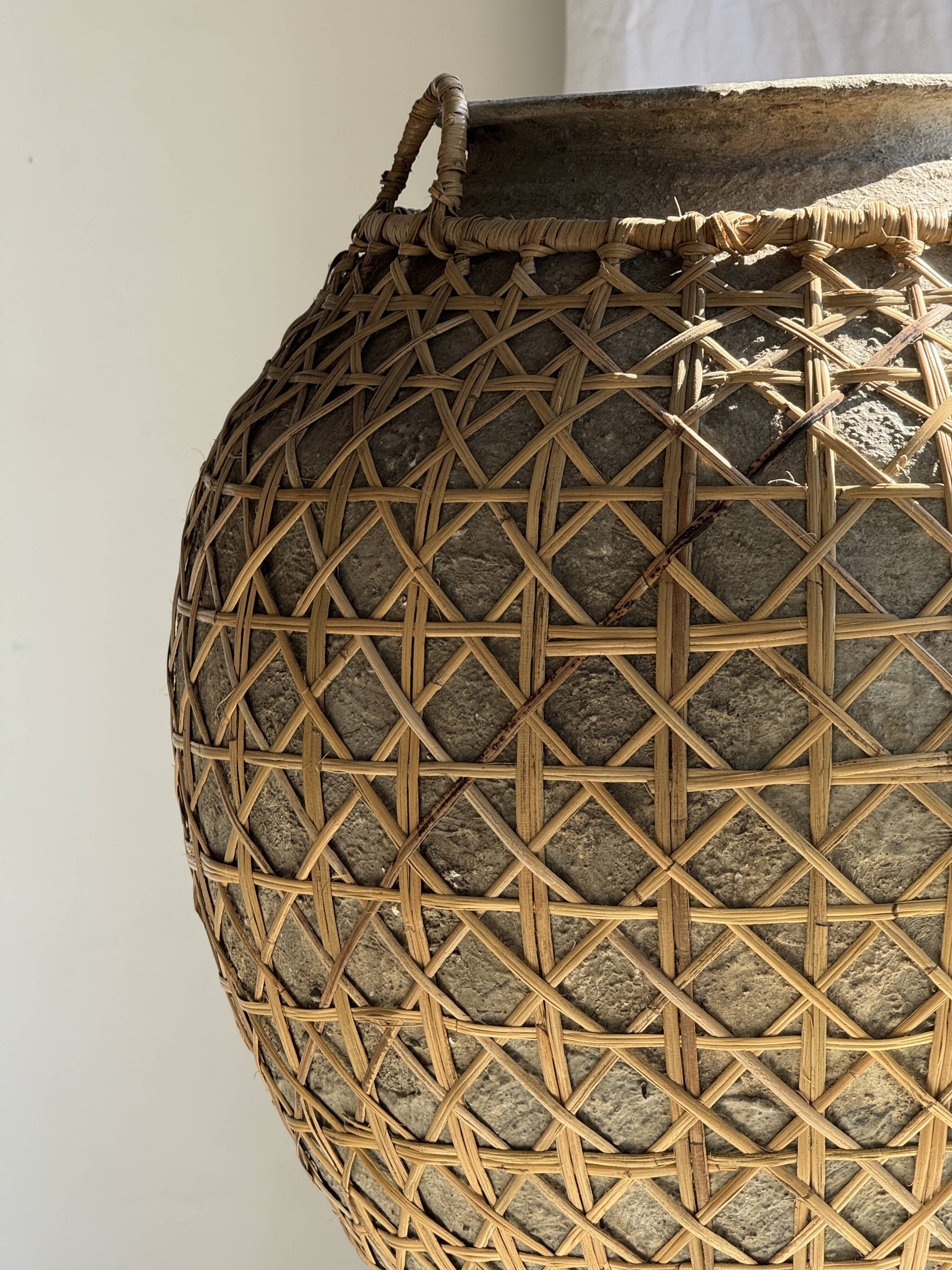 Immense light grey antique-style pot with a crosshatch lid and handles.