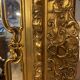 Wooden mirror with gilded stucco