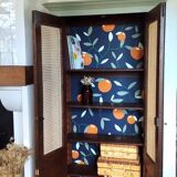 Caned cabinet with oranges