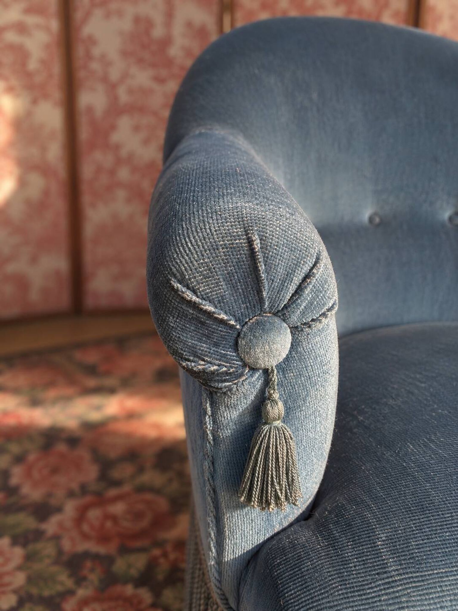 Vintage blue velvet frog chair, a timeless comfortable piece.