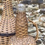 Glass bottles and rattan, woven wicker