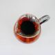 Large red and blue glazed ceramic pitcher signed Delène under the base