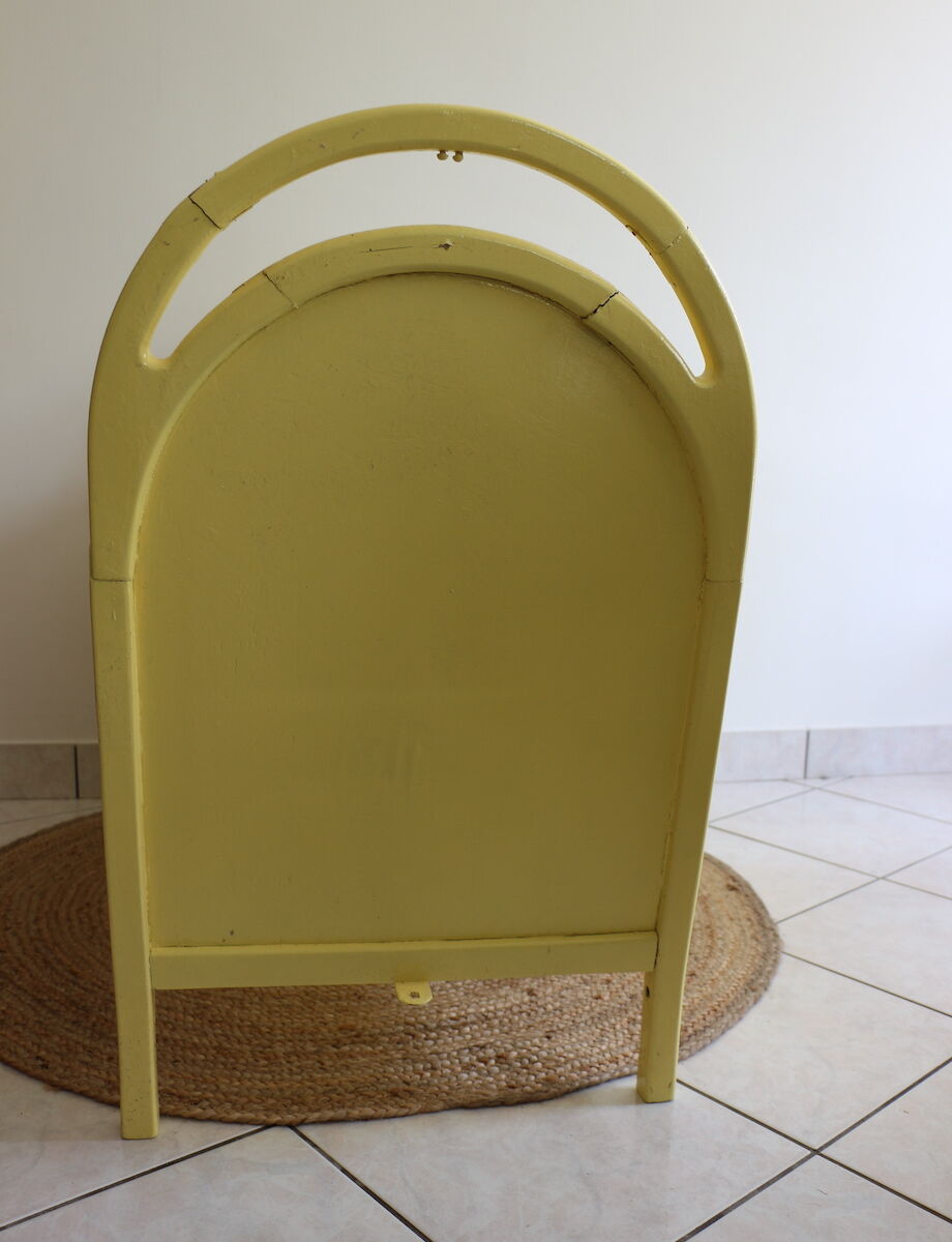 Yellow vintage baby cot