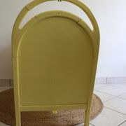Yellow vintage baby cot
