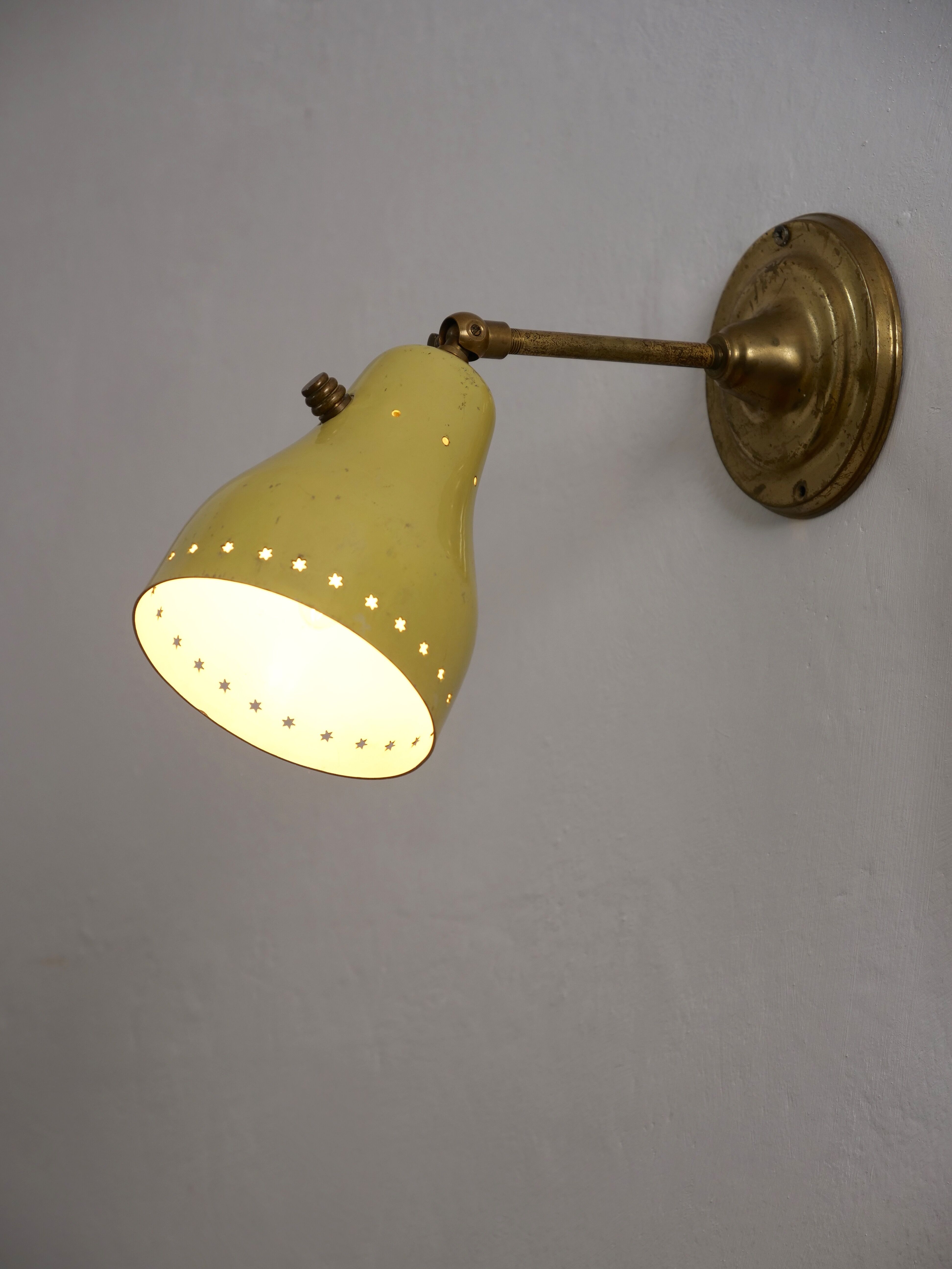 Wall lamp inlaiton and pale yellow lacquered metal