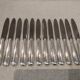 12 silver-plated dessert knives by the silversmith Ercuis, Senlis, 20.3 cm.