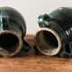 Set of two Chinese green glazed stoneware storage jars.