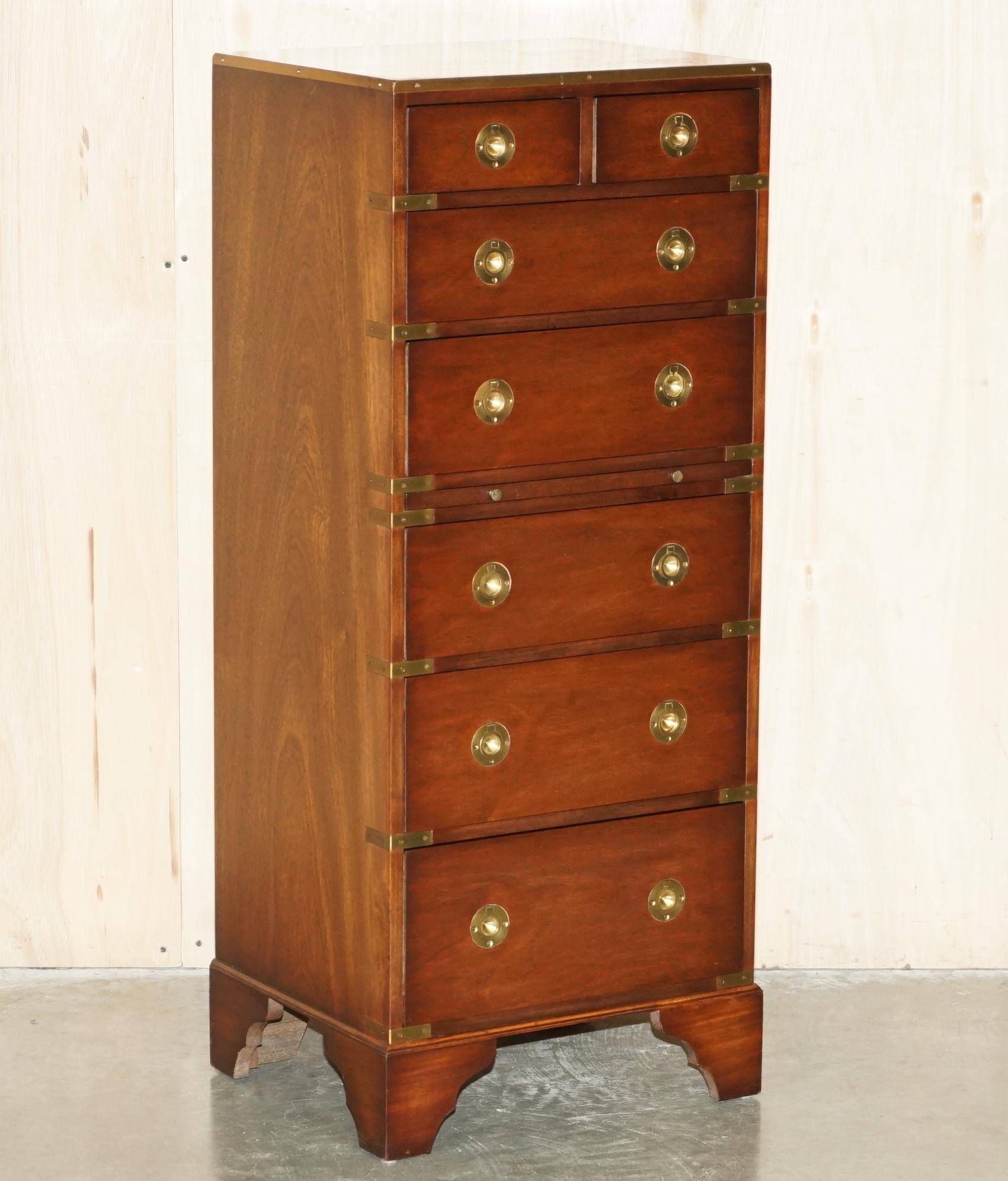 Pair of vintage military campaign high chests of drawers with leather tops.