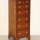 Pair of vintage military campaign high chests of drawers with leather tops.