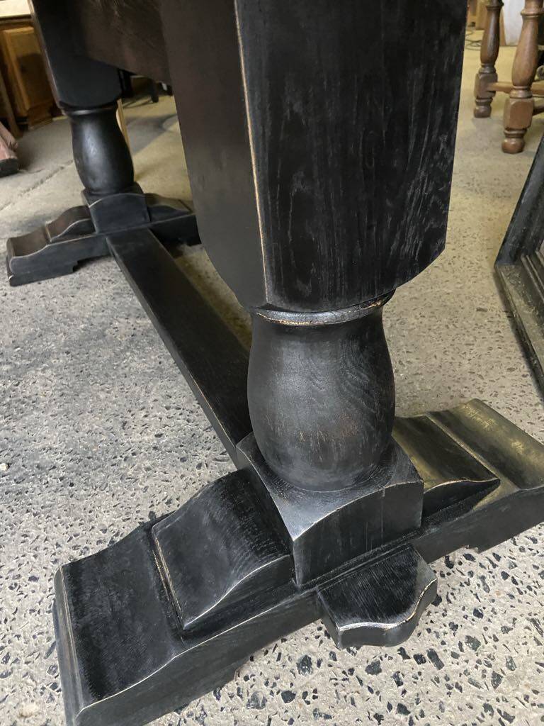 Raw wood table with black legs