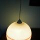Space age pendant lamp, white opaline with orange silkscreened geometric designs