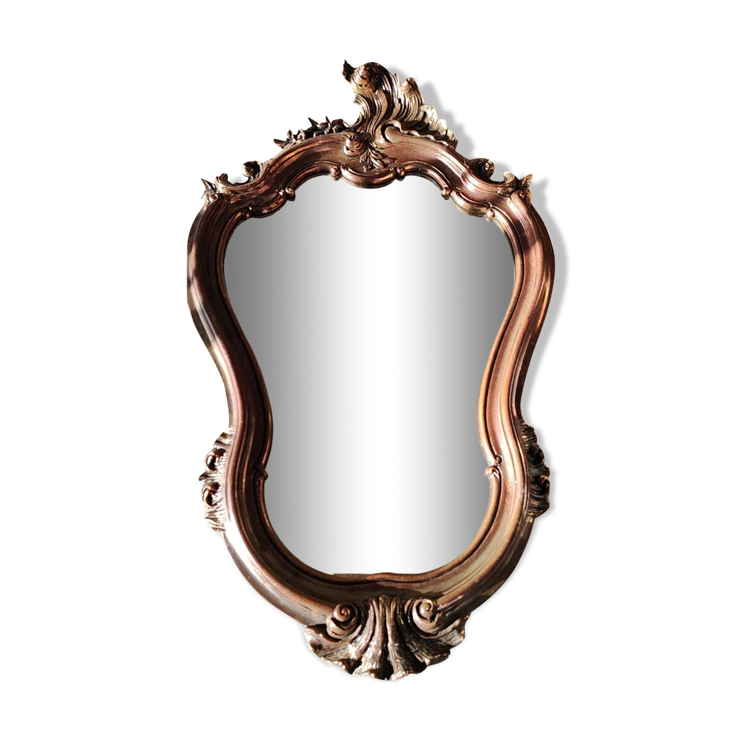 Pretty Baroque style mirror / Louis XV patinated with pink / golden copper reflections. Volutes, leafy shells