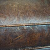 Dark sheep leather club armchair, sleek design