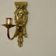 Pair of mid-century Swedish brass face motif sconces