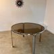 Table ronde vintage tubulaire en métal et verre fumé design année 70