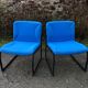 Electric blue fabric designer armchairs with black lacquered metal legs from the 80s.