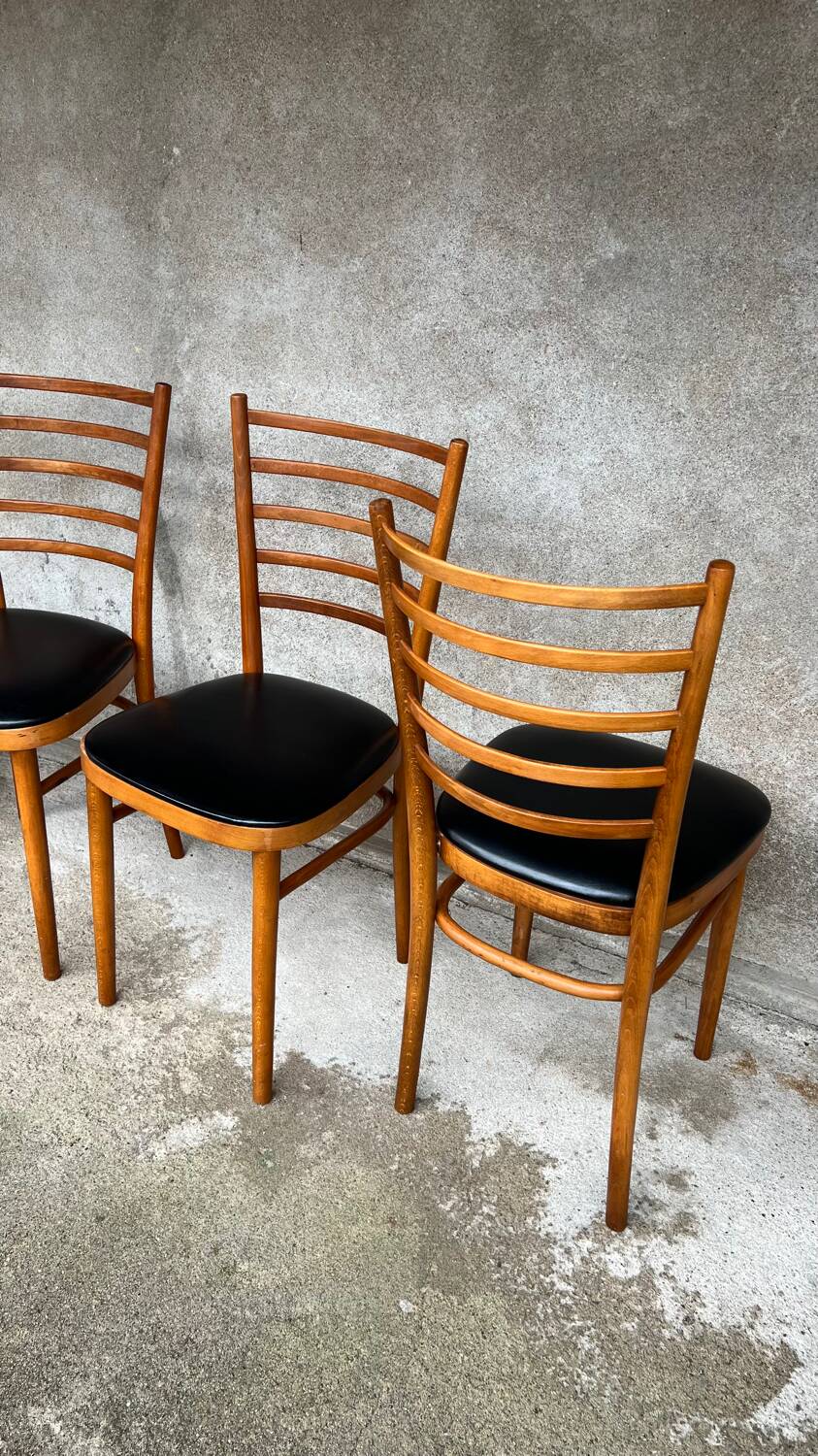 Set of 4 vintage wooden chairs with faux leather.