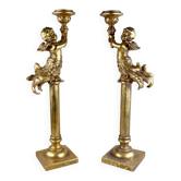 Pair of large candlesticks with cherubs