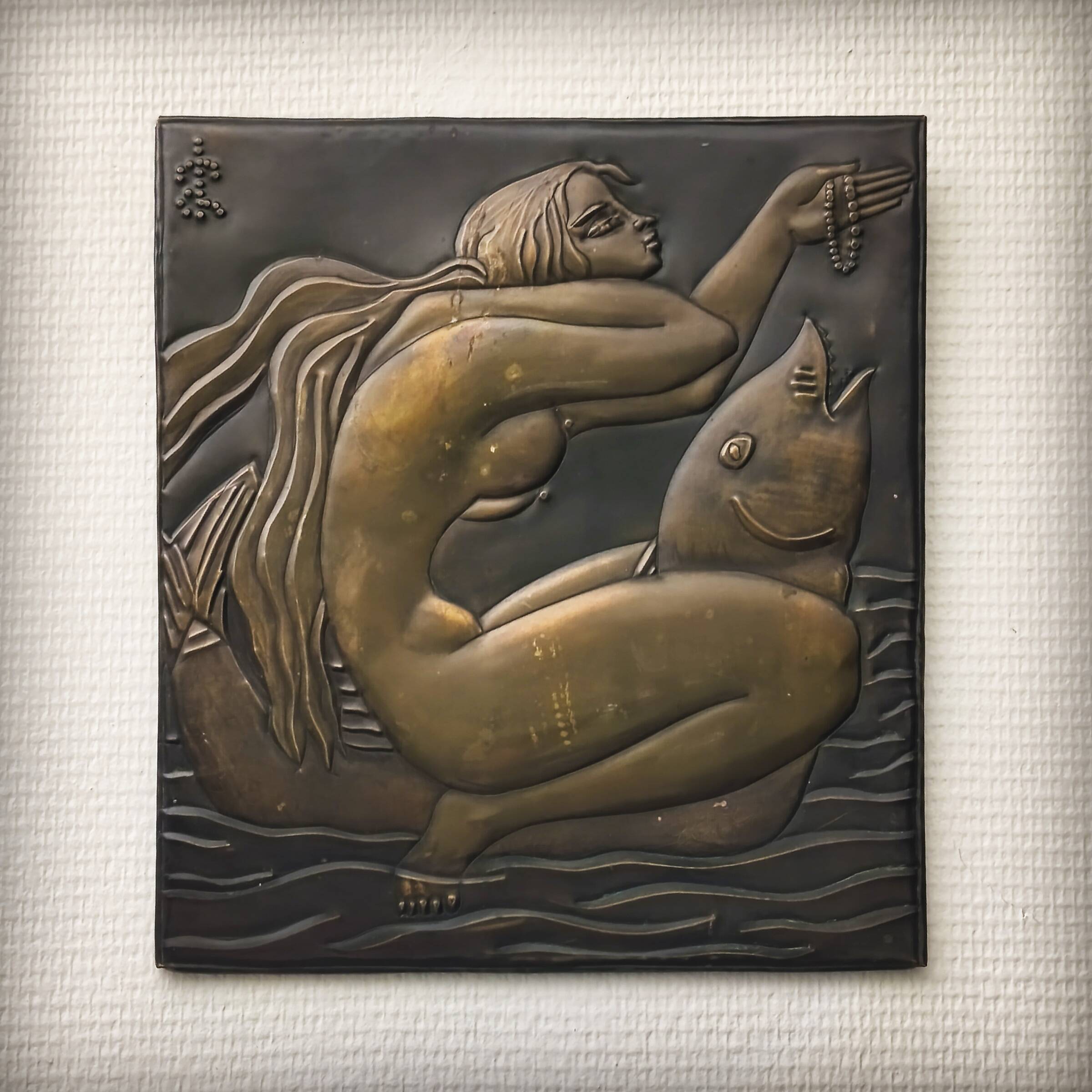 Brass table featuring a woman and a dolphin, France, 1960s.