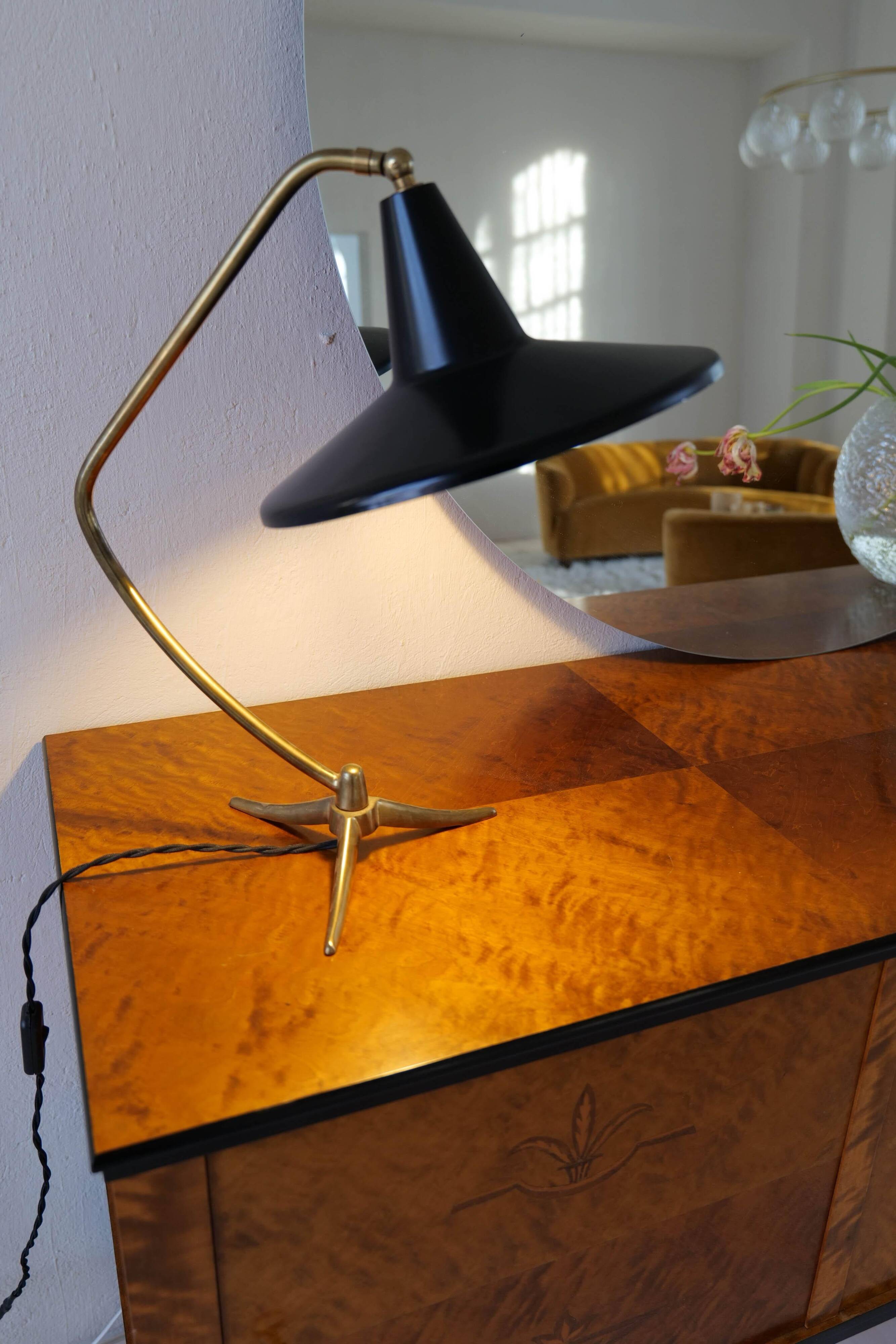 Brass table lamp on a tripod in modern Swedish style, Sweden, 1950.