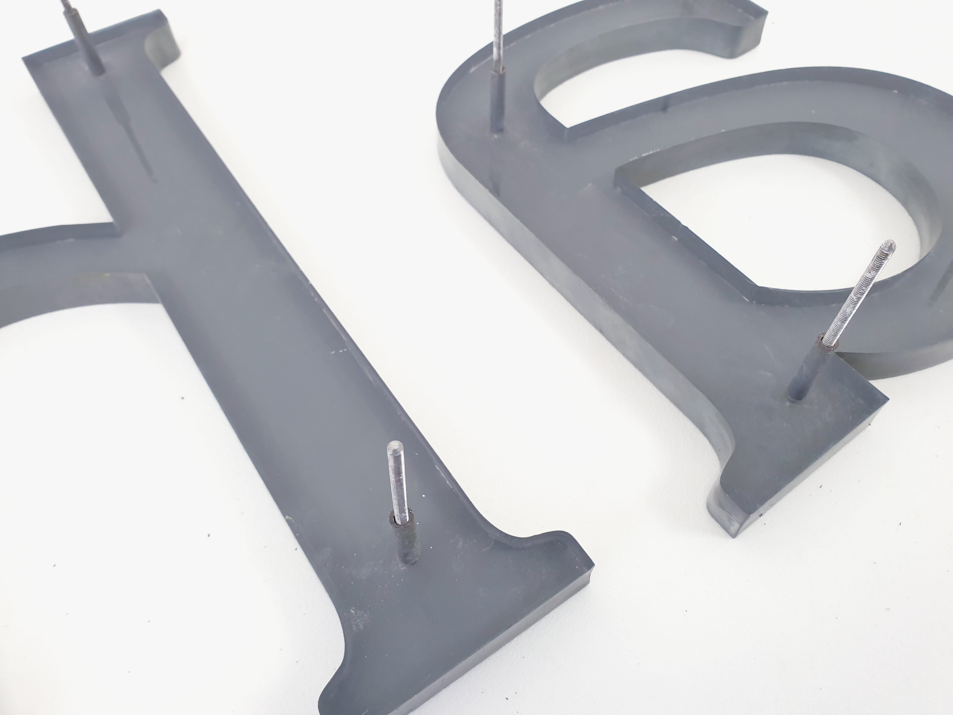 "Ah." sign letters from the patinated grey 70s