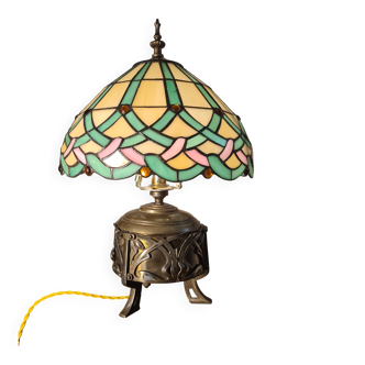 bronze and brass Art Nouveau lamp from 1900 with a glass shade