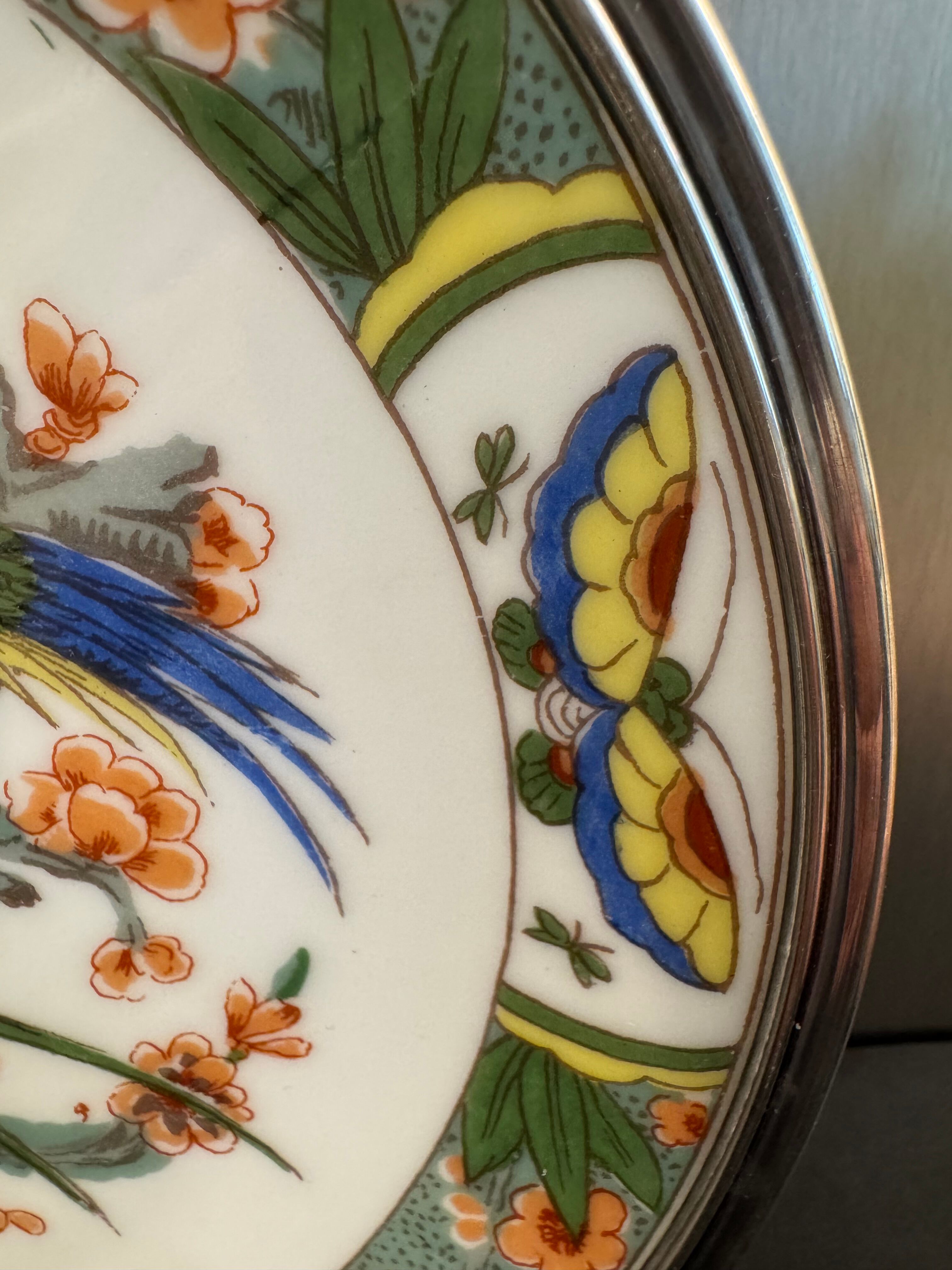 Two Raynaud Limoges plates and Tetard brothers silver.
