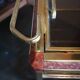 Brass and smoked glass bar trolley with casters
