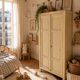Small antique wardrobe patinated in beige and yellow.