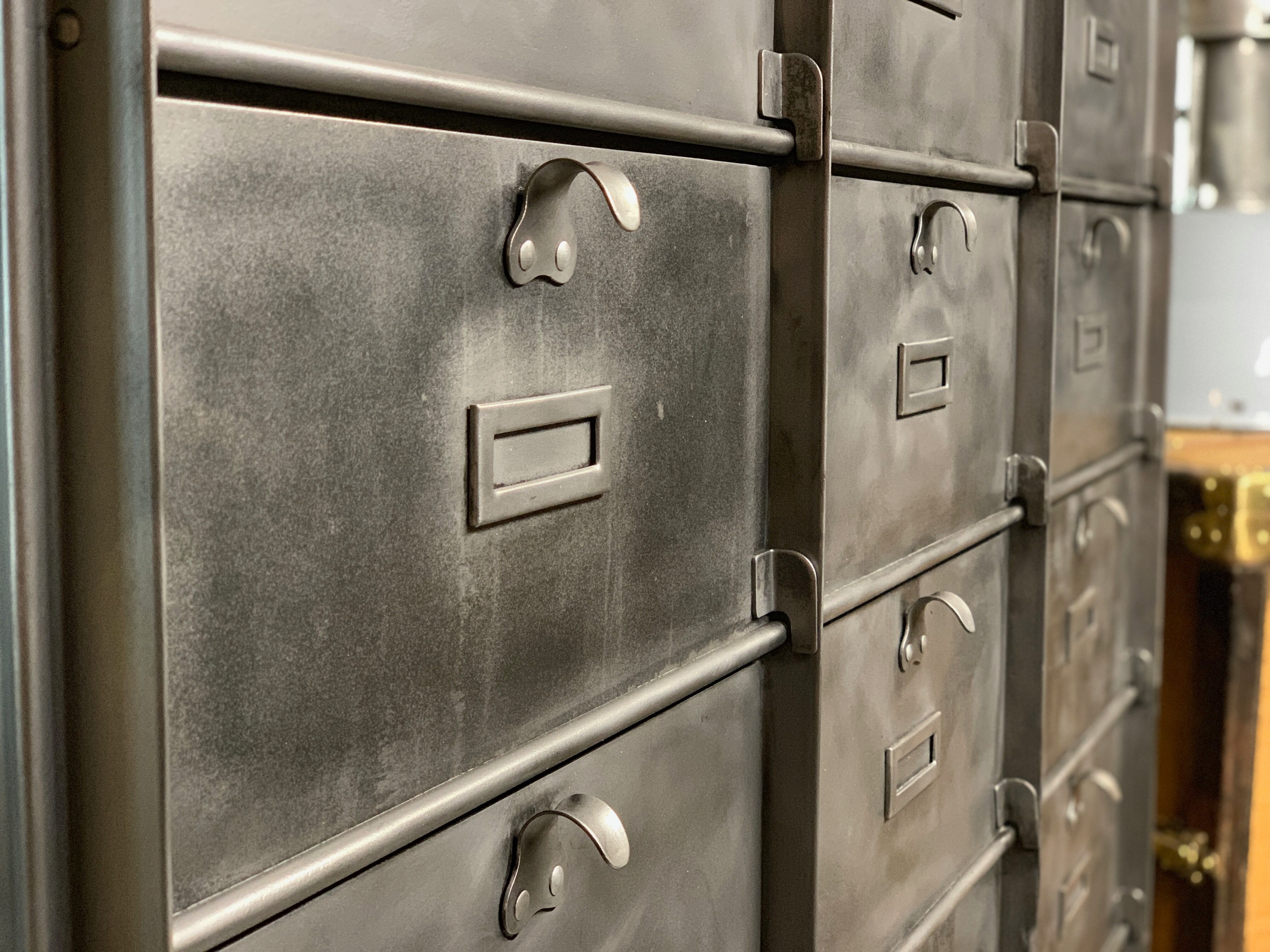 Industrial cladding furniture in brushed and patinated steel