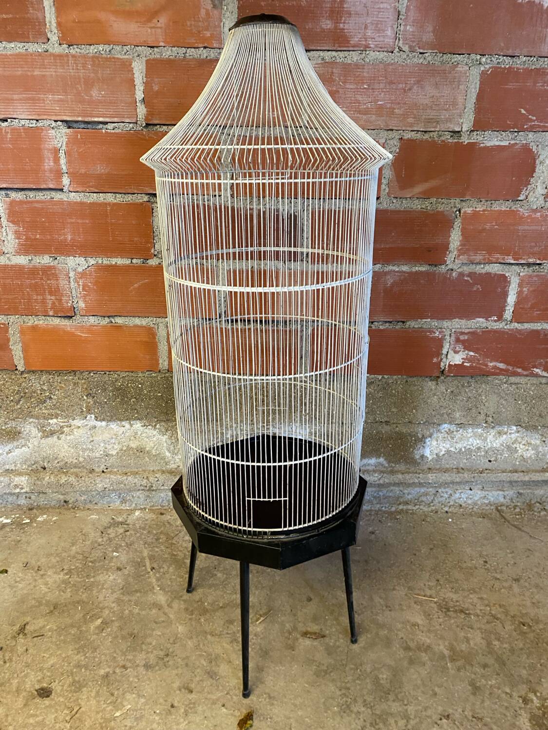 Antique black & white metal bird cage on vintage decorative legs