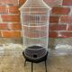 Antique black & white metal bird cage on vintage decorative legs