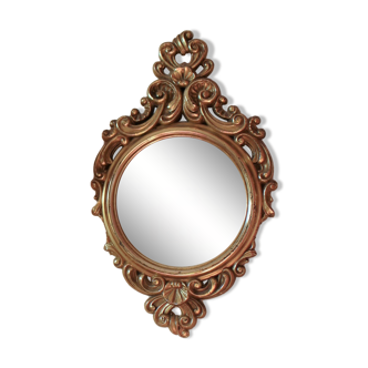 Round worked golden mirror