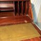 Antique mahogany secretary, upholstered flap and interior storage