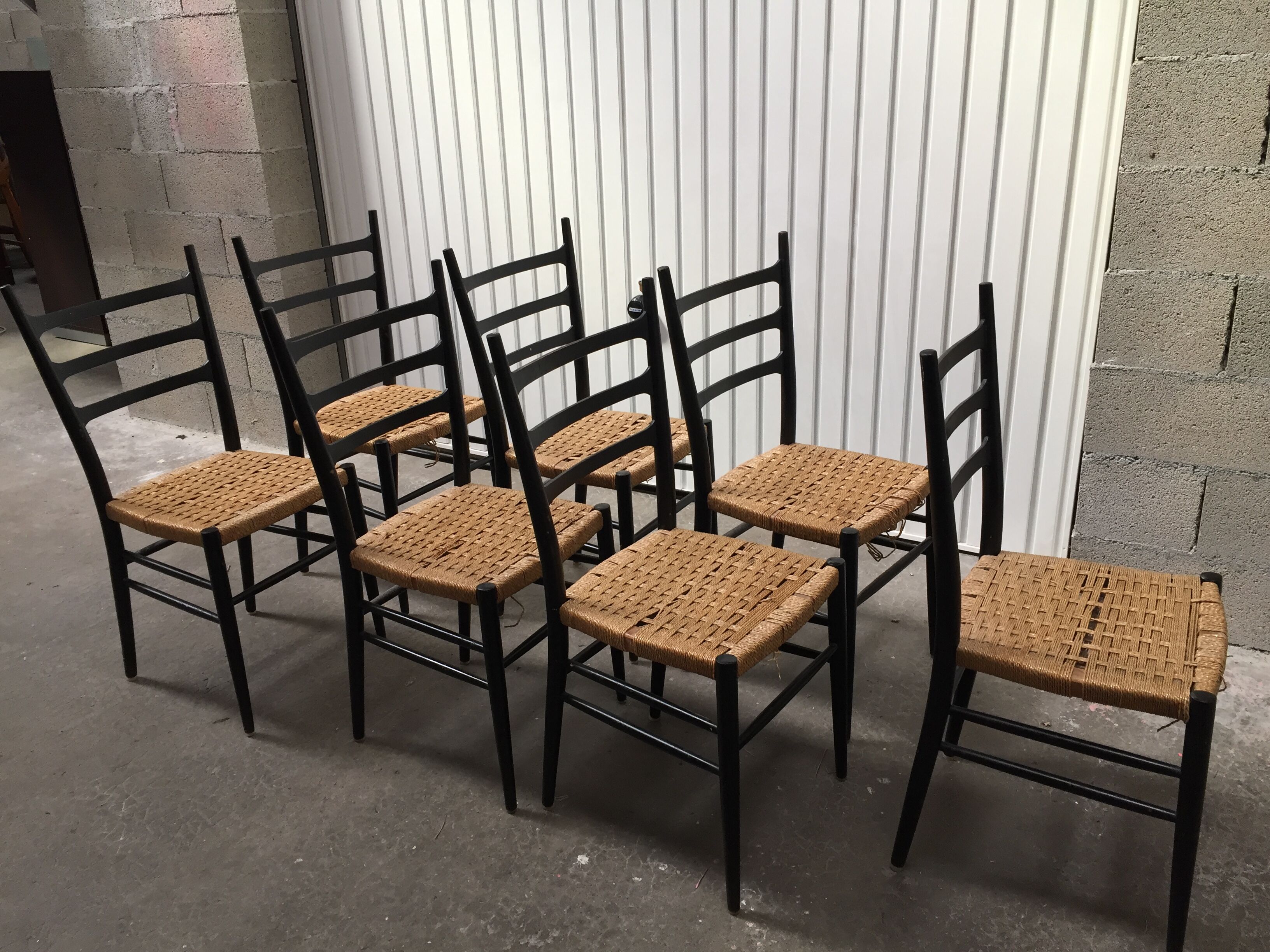 Set of 7 blackened wooden chairs, 1960s vintage