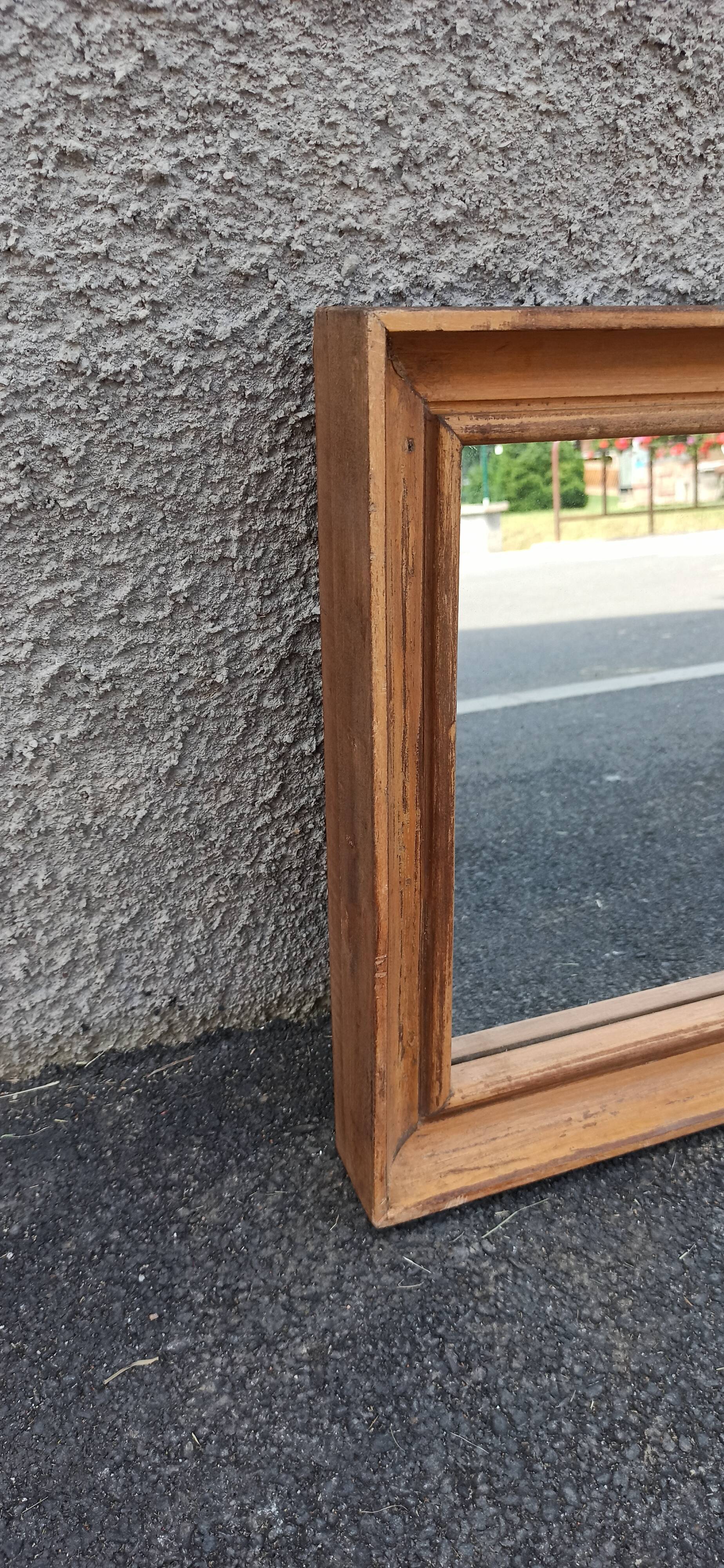 Square mirror in old wood